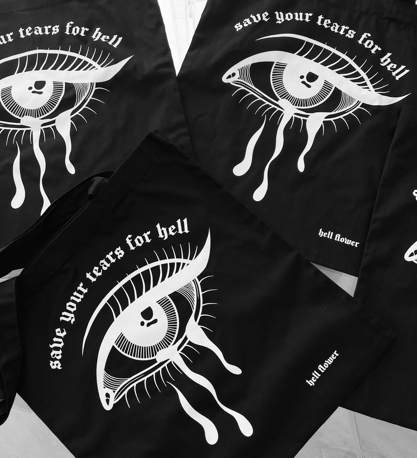 Hell flower crying eye tote bag